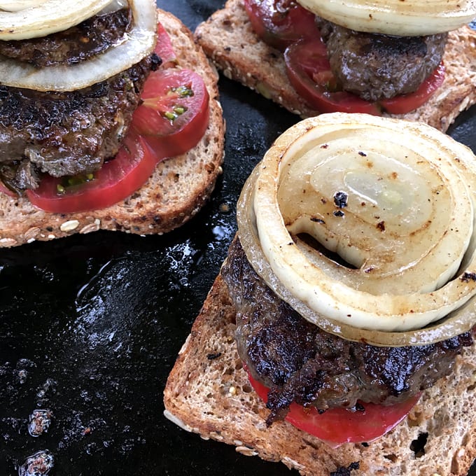 Open-Faced Pesto Cheeseburgers with Grilled Onions