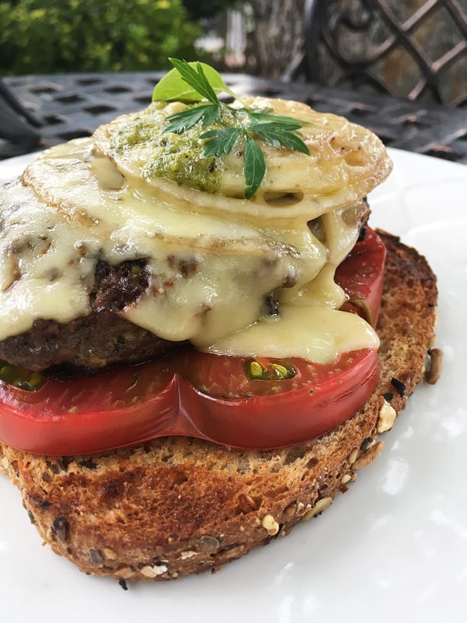 Open-Faced Pesto Cheeseburgers with Grilled Onions